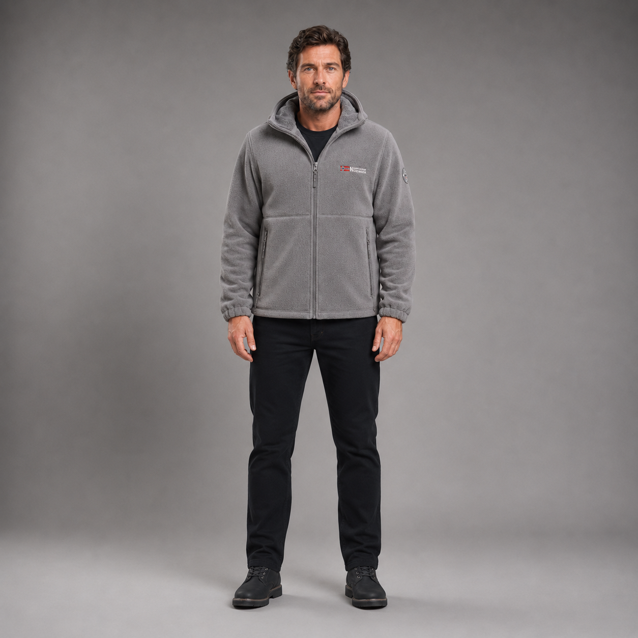 Man wearing gray thermal fleece jacket in full-body front studio view