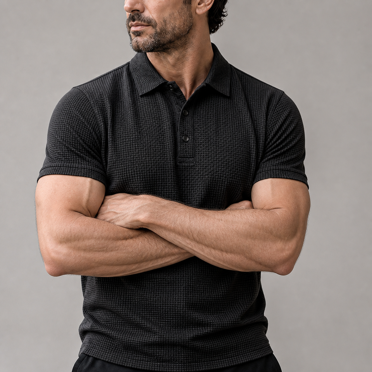 Man wearing the Omni textured polo shirt in a studio